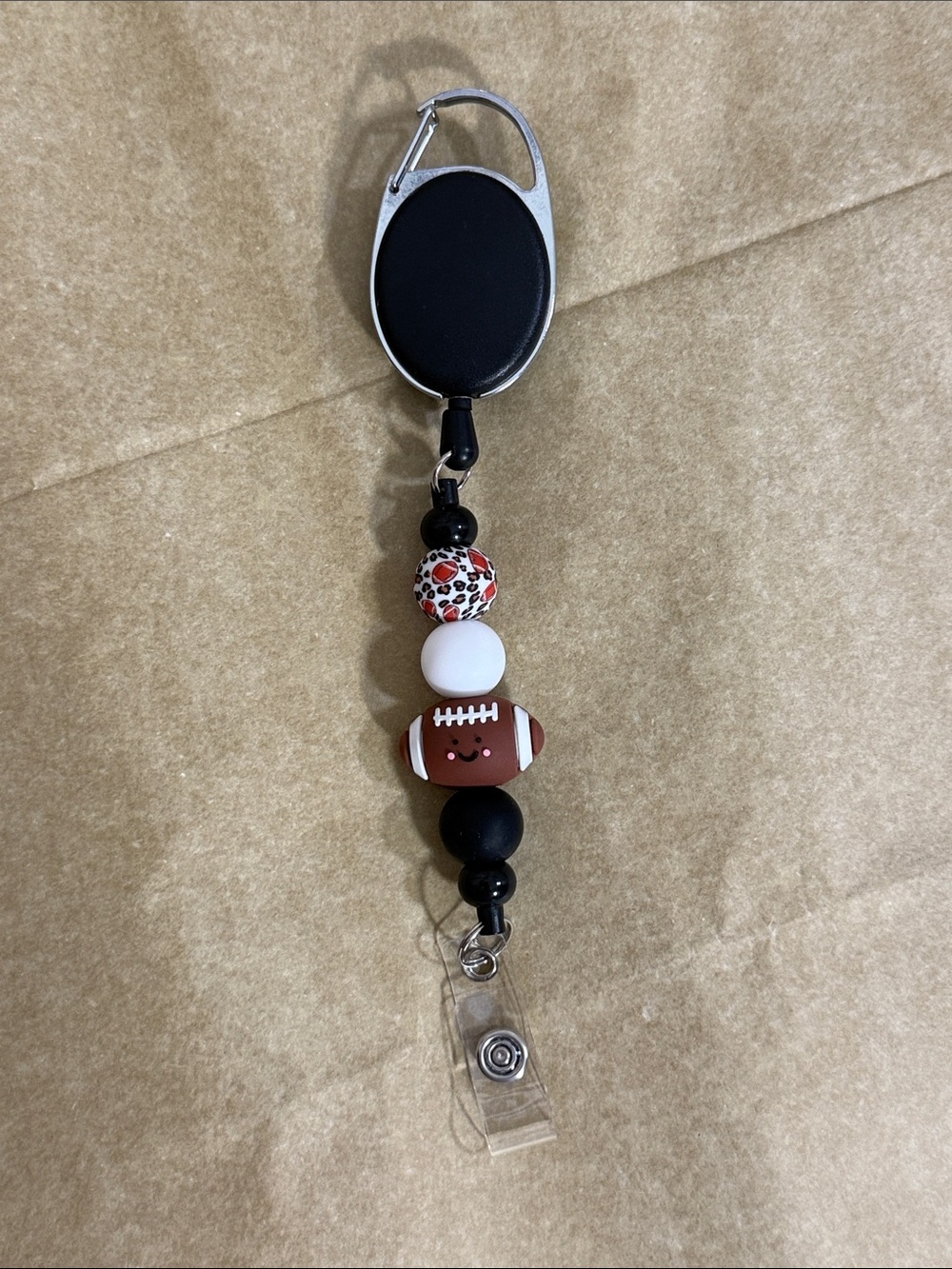 Black and Brown Football Bead Badge Reel